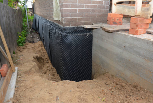 SJ Waterproofing Pros technician performing targeted Waterproofing assessment in Malvern, OH